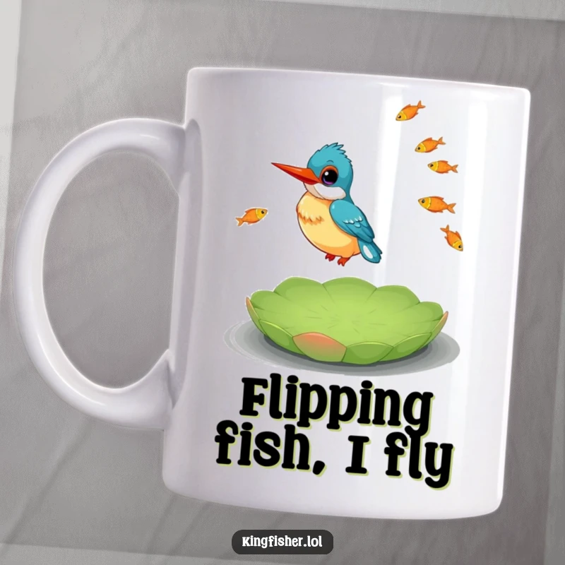 Funny Kingfisher Mug showing a happy kingfisher skillfully juggling small fish while balancing on a lily pad.