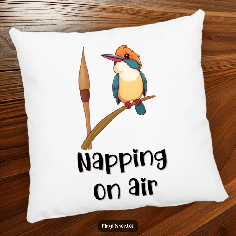 Funny happy kingfisher bird pillow, precariously perched on a swaying reed, looking upwards with a smile, offering soft comfort and cheerful humor.
