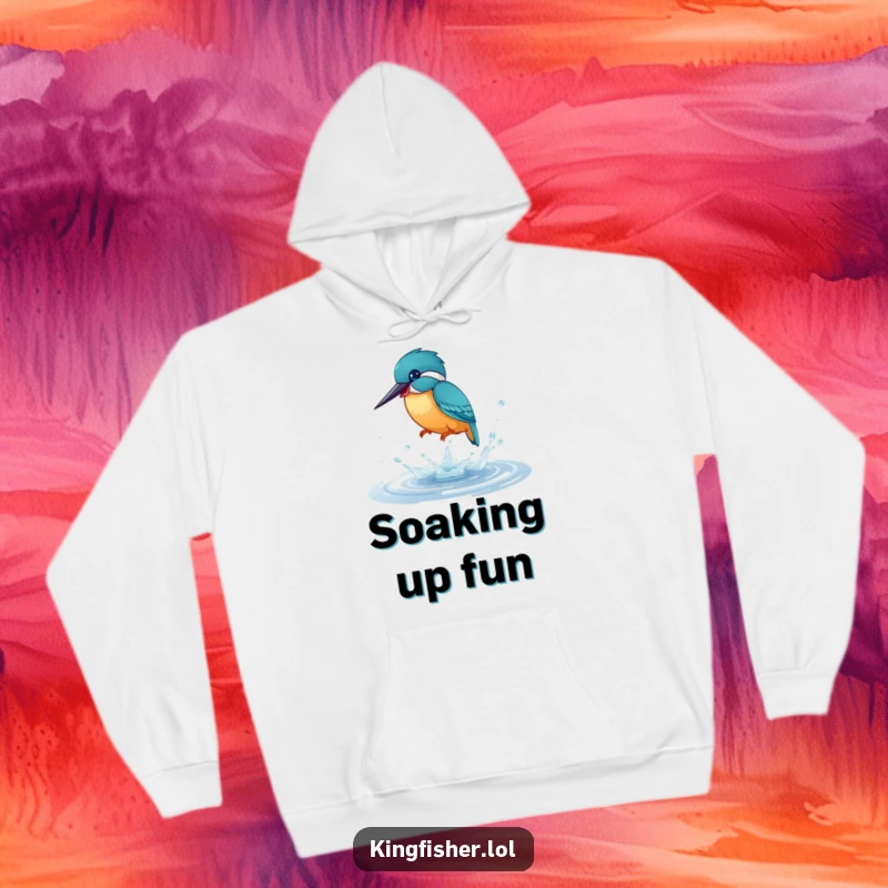 Funny Hoodie: A vibrant kingfisher bird joyfully splashing in a tiny puddle, embodying playful energy and warm comfort.