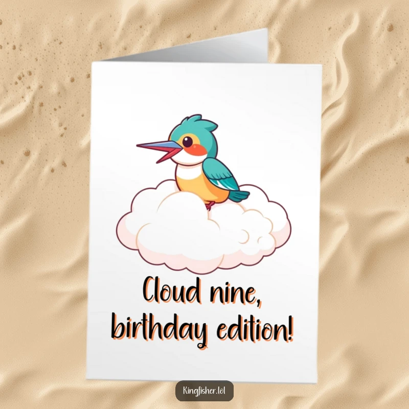 Funny Free Printable Birthday Card with a laughing kingfisher bird riding on the back of a giant, fluffy cloud, embodying pure birthday bliss.