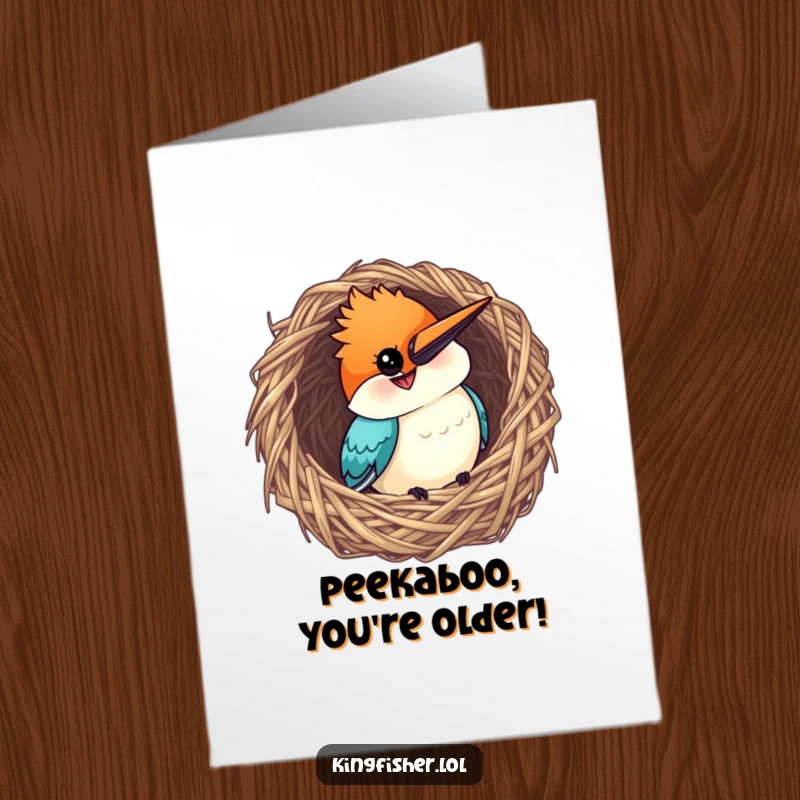 Funny Free Printable Birthday Card: Curious kingfisher peeking from a woven nest with a wide, cheeky grin.