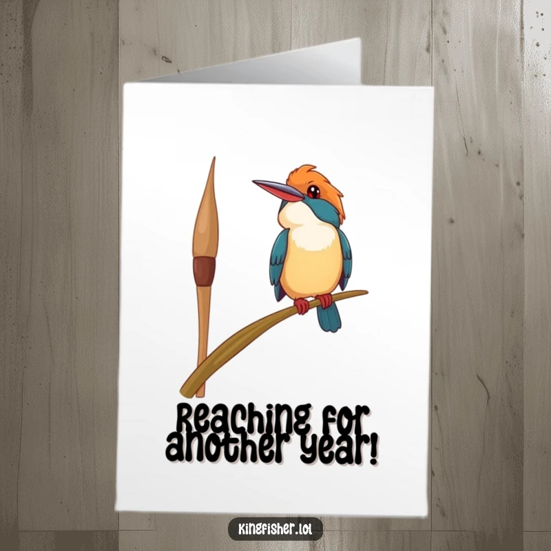 Funny Free Printable Birthday Card featuring a happy kingfisher bird perched precariously on a swaying reed, smiling upwards. DIY gift.