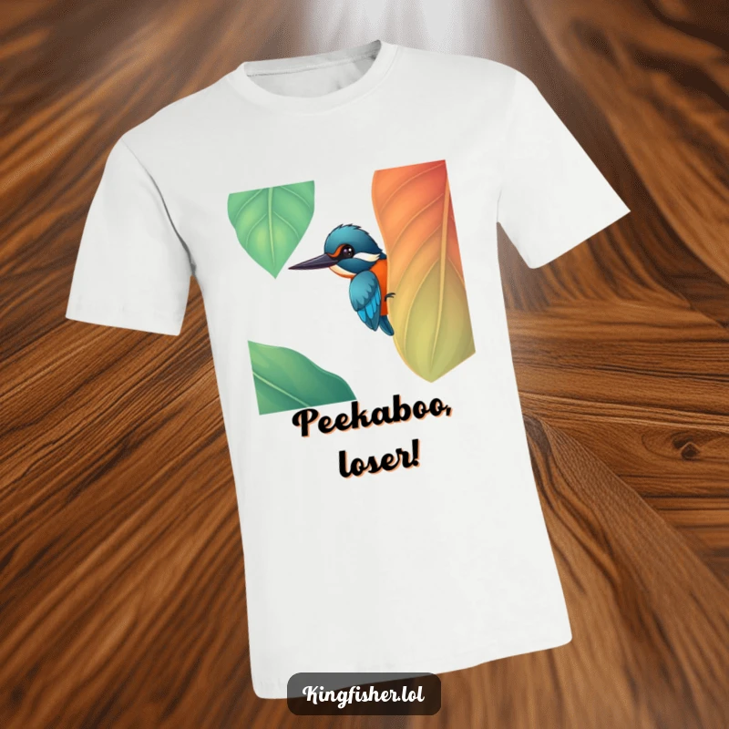 Funny cheerful kingfisher bird peeking from a large, colorful leaf on a t-shirt, a perfect funny gift.