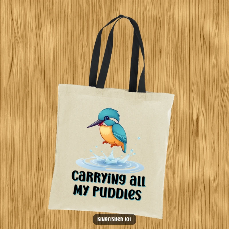 Funny Tote Bag: A kingfisher bird caught mid-splash in a shimmering puddle, showcasing playful energy and vibrant joy.