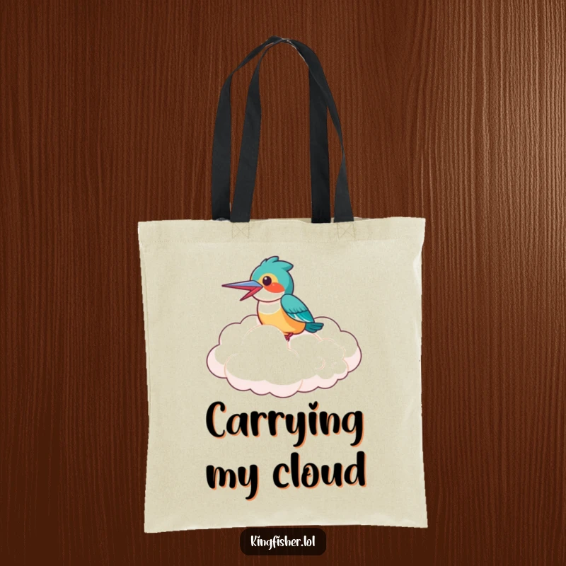 Funny Tote Bag: A laughing kingfisher bird riding high on a giant, fluffy cloud, symbolizing freedom and cheerful humor.